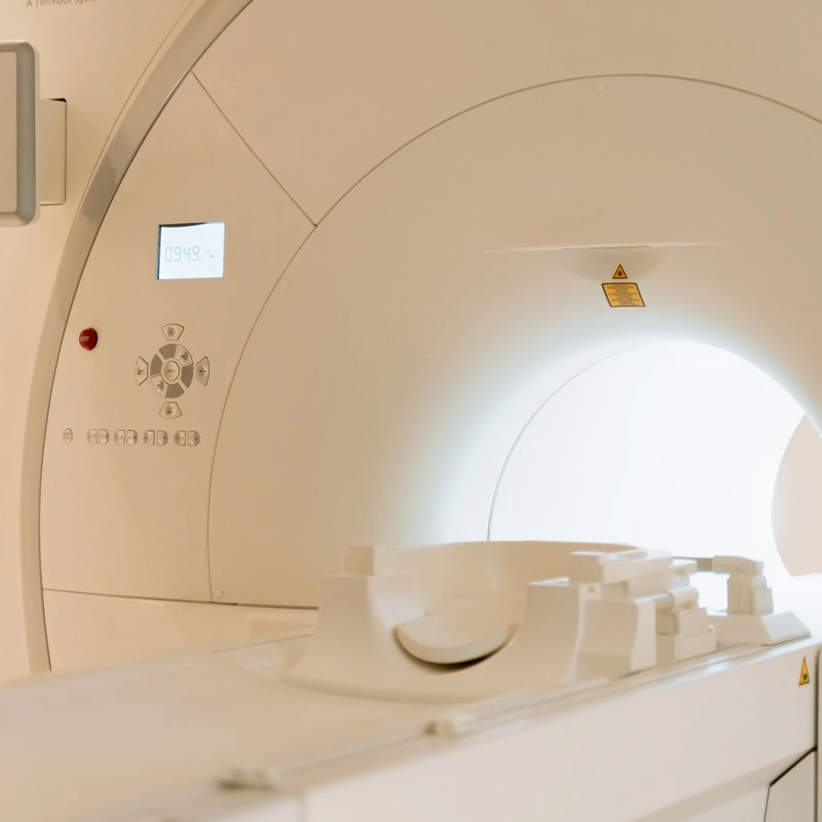 A modern CT scanner in a hospital imaging room.