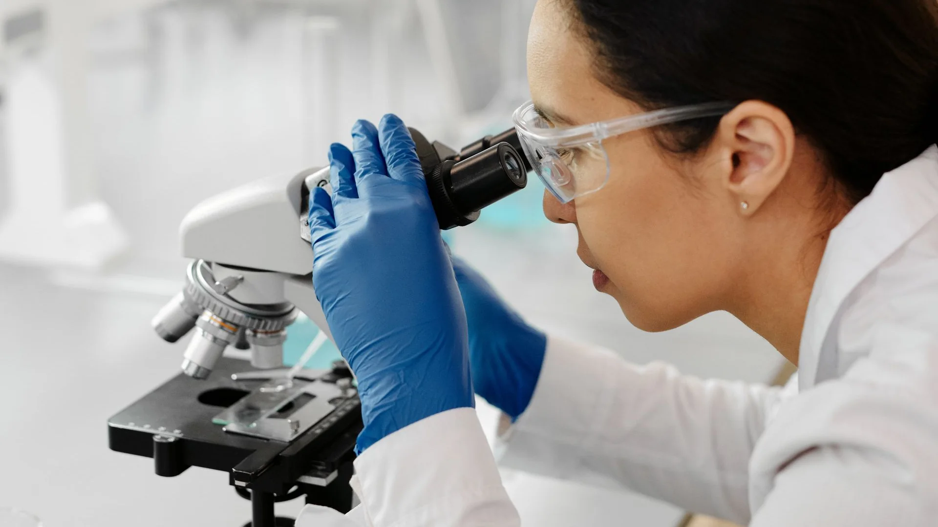 A scientist working with a microscope.